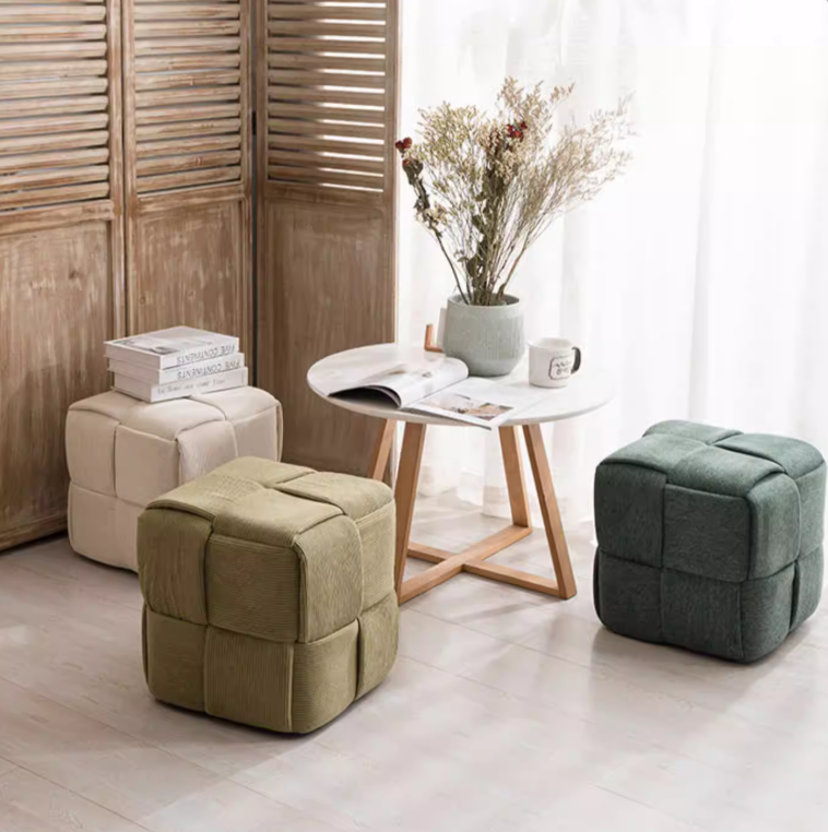 Bottas woven cube pouf ottoman upholstered in corduroy-style fabric for modern interiors