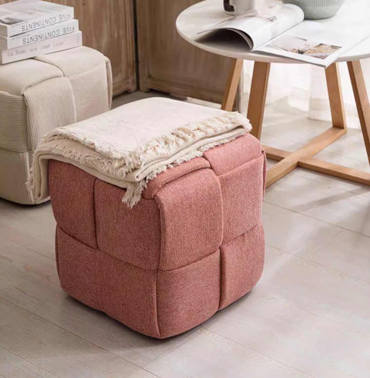 Pink modern cube pouf stool featuring textured corduroy upholstery and woven construction