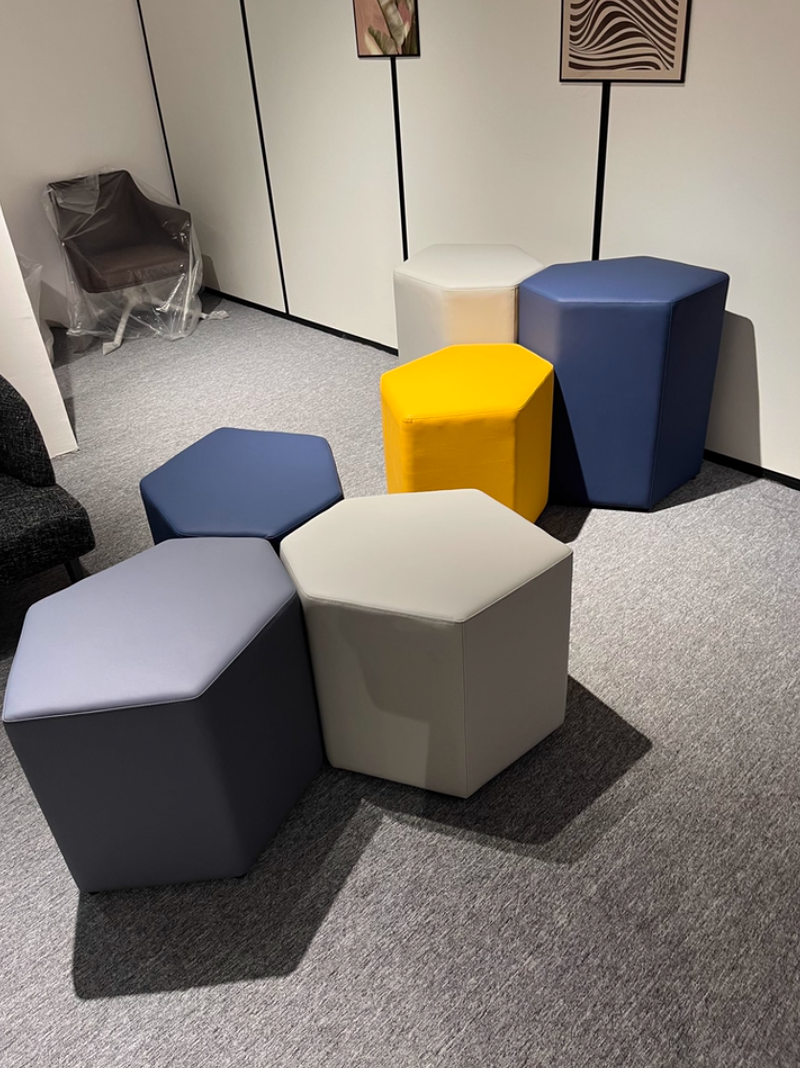 Shatkon hexagon pouf used as casual seating in a lounge area