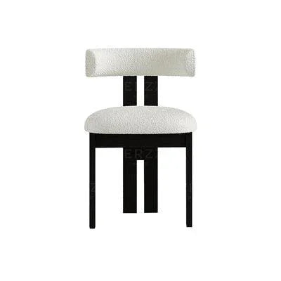 Modern DEVAL blakely dining chair upholstered in soft bouclé fabric with wooden legs