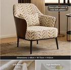 A modern accent chair with deep coffee-colored leather side panels and black metal legs, upholstered in a beige and brown tree-leaf patterned fabric. The image includes text overlays detailing the pattern, dimensions, and fabric features.