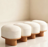 Minimalist long bench with textured bouclé upholstery and ash wood base