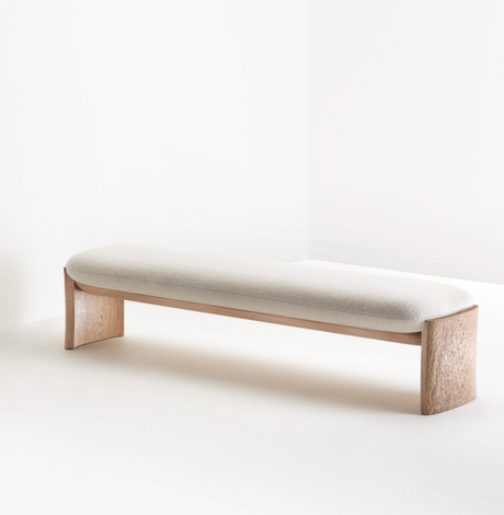 Deepa modern dining bench with high-resilience foam cushioning in white wash.