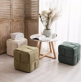 Bottas woven cube pouf ottoman upholstered in corduroy-style fabric for modern interiors