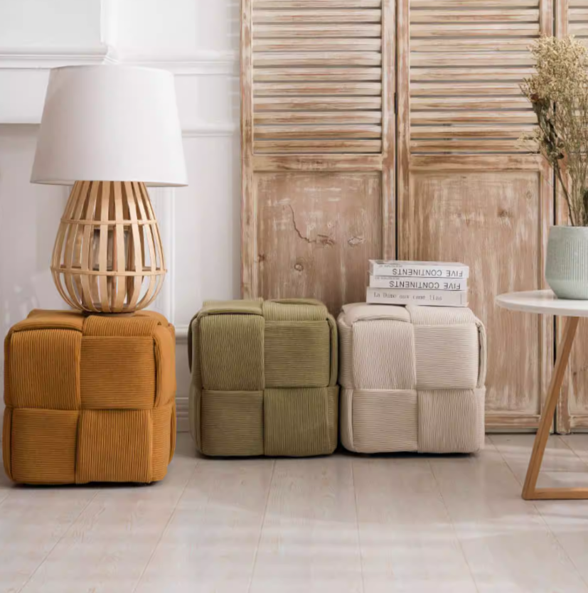 Lumo corduroy fabric cube pouf with intricate weaving design used as footrest and extra seating