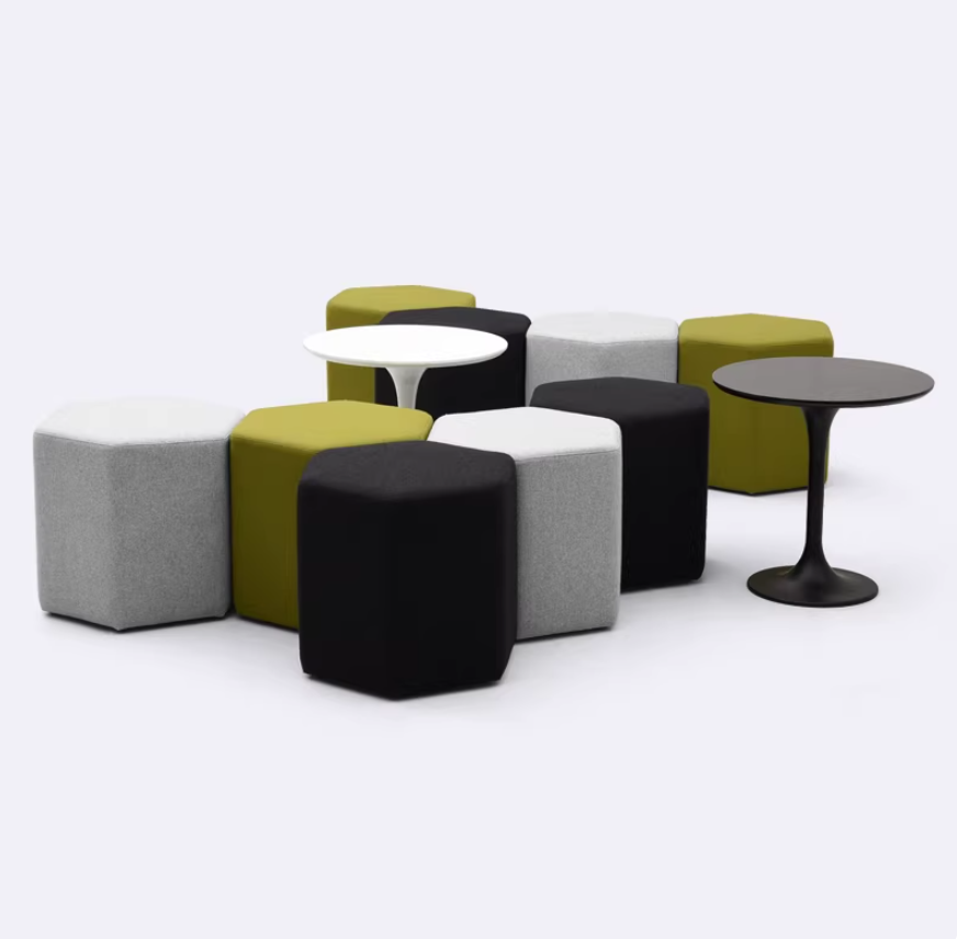 Modular hexagon pouf seating cluster in upholstered fabric