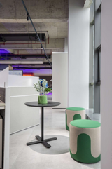 Drava pouf used as flexible seating in a contemporary interior