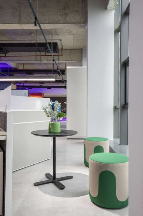 Drava pouf used as flexible seating in a contemporary interior