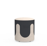 Drava Drip pouf with fluid wave pattern upholstery in a modern office lounge