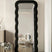 black fabric upholstered mirror