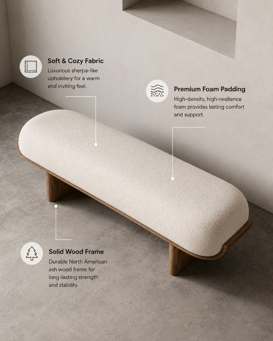 A low upholstered bench with a cream bouclé seat cushion and natural wood legs, shown in a minimalist interior with callout text describing soft fabric, premium foam padding, and a solid wood frame.