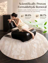 A woman in a cream dress sits on a black leather chair placed on a round beige rug in a modern room. Large text at the top reads 'Scientifically Proven Formaldehyde Removal' with removal rate claims and green leaf graphics.