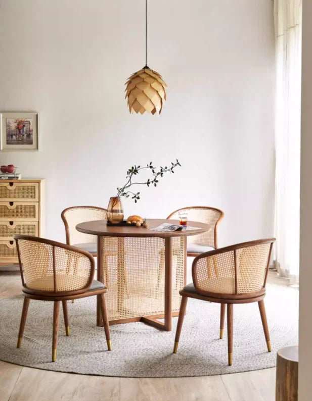 Elio cane dining armchair featuring handwoven rattan back.