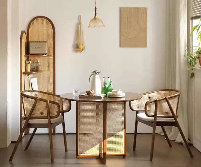 Scandinavian-style armchair with solid wood seat, curved armrests and woven cane backrest