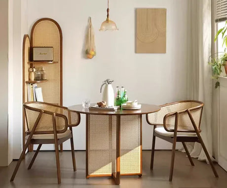 Scandinavian-style armchair with solid wood seat, curved armrests and woven cane backrest
