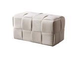 Bottas rectangular bench pouf with textured woven upholstery used as extra seating