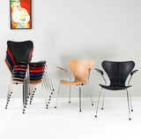 Modern stackable chairs in black, wood, and colorful options for home or office use