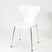 White modern dining chair with chrome legs, minimalist design for home or office use