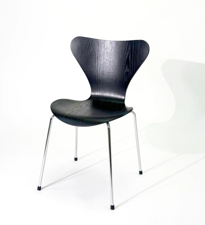 Modern black wood dining chair with chrome legs, sleek design for home or office use