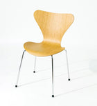 Modern wooden chair with chrome legs, sleek design for home or office use