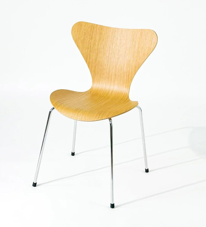 Modern wooden chair with chrome legs, sleek design for home or office use