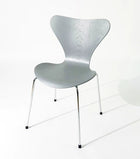 Modern silver chair with sleek metal legs, ideal for home or office furniture in Singapore