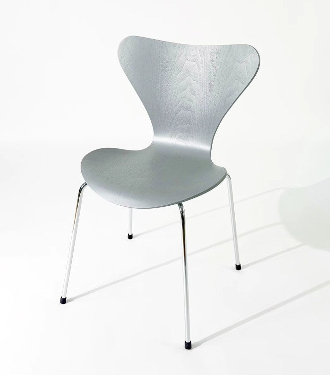 Modern silver chair with sleek metal legs, ideal for home or office furniture in Singapore