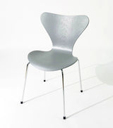 Modern silver chair with sleek metal legs, ideal for home or office furniture in Singapore