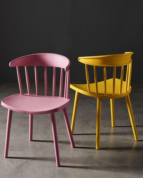 pink and yellow plastic dining chair