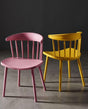 pink and yellow plastic dining chair