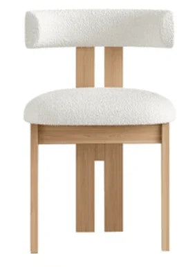 Luxury bouclé blakely deval dining chair featuring padded seat and sculptural wooden frame