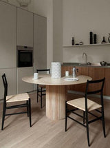 minimalist round solid wood dining table